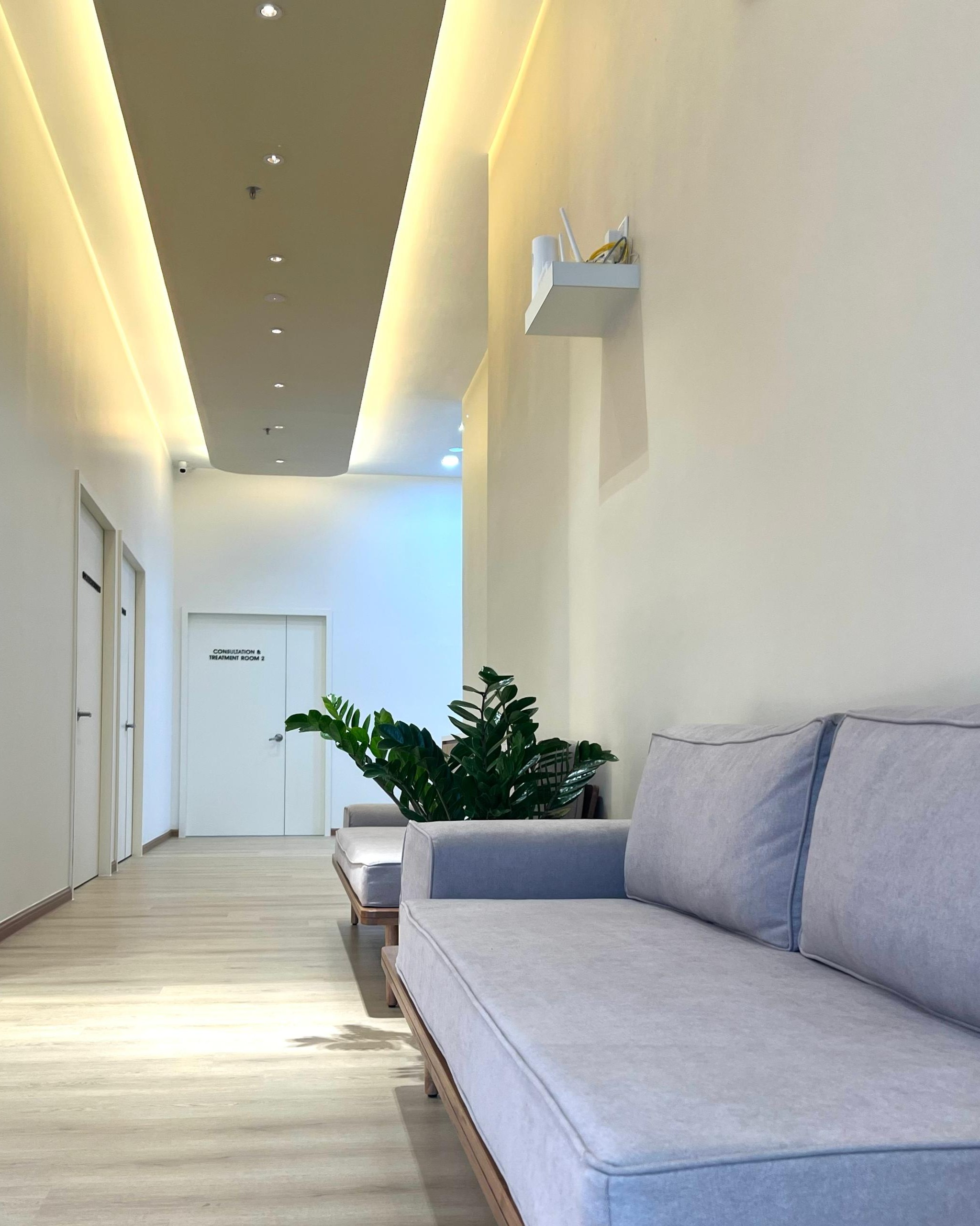 Hallway leading to the consultation and treatment rooms at OneHealth Clinic Bukit Indah