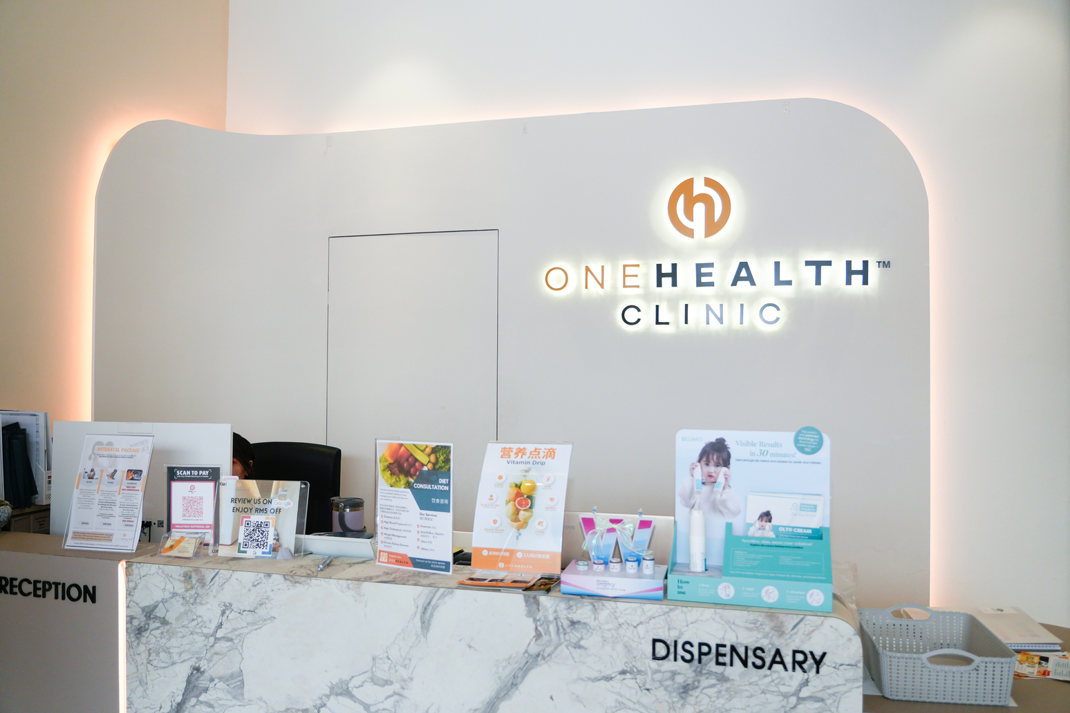 Reception and dispensary desk at OneHealth Clinic Bukit Indah