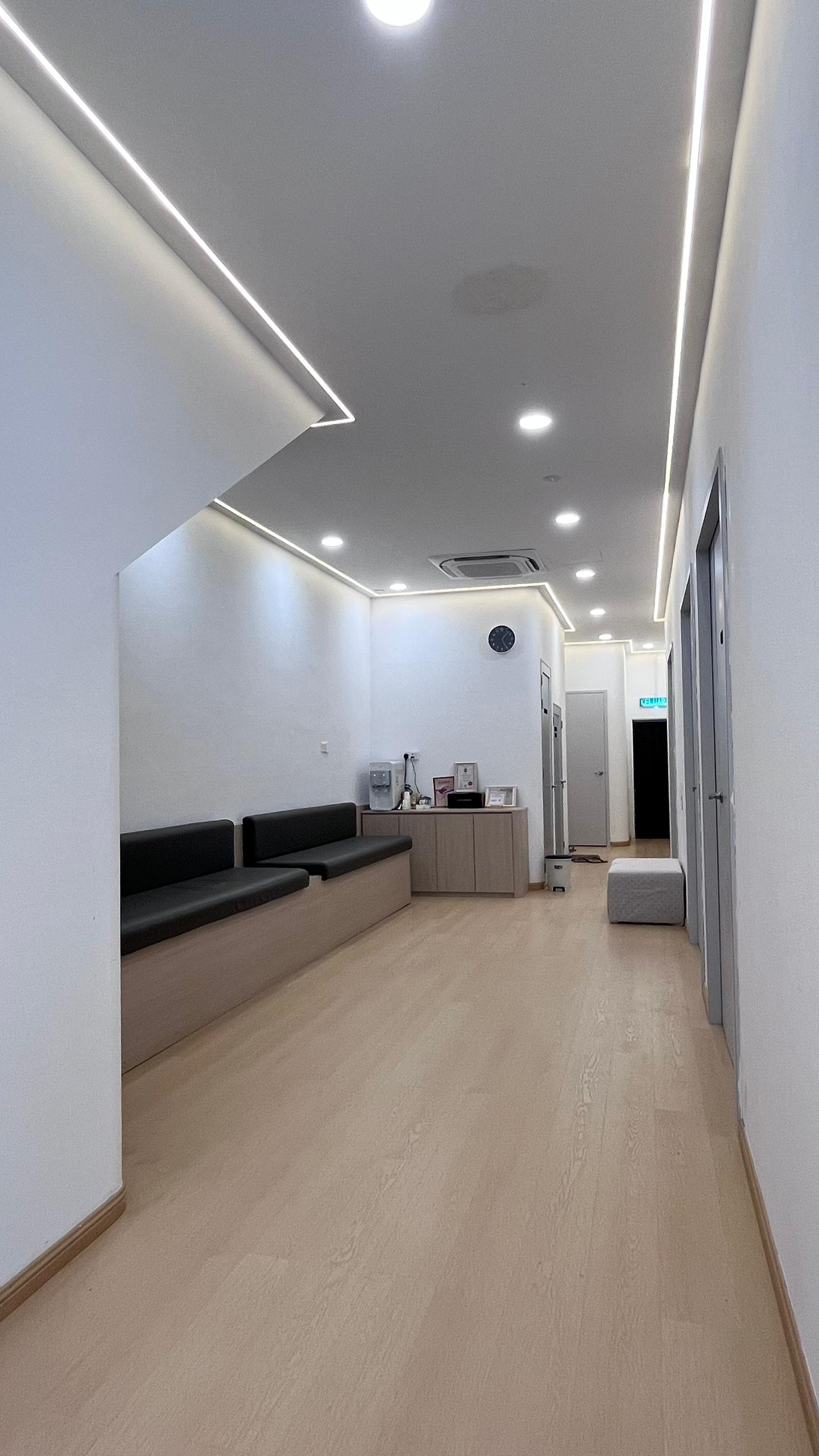 Waiting area seating and hallway at OneHealth Clinic Pontian